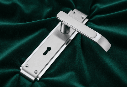 close up view of very top notch classic stainless steel mortise lock backdropped by premium velvet febric,gloss accents with matt body by ambica tools hardware